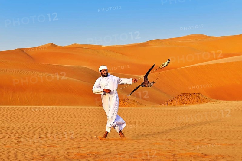 Falconer in the desert luxury hotel Anantara Qasr Al Sarab