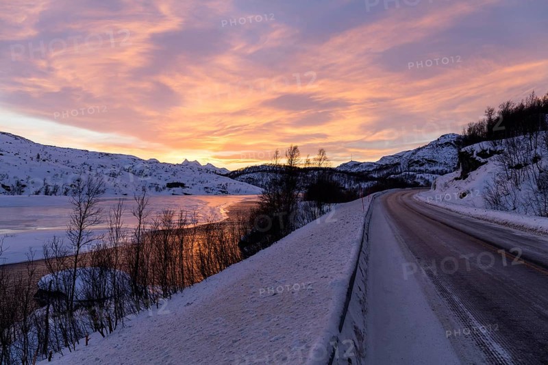 Dawn over half frozen lake