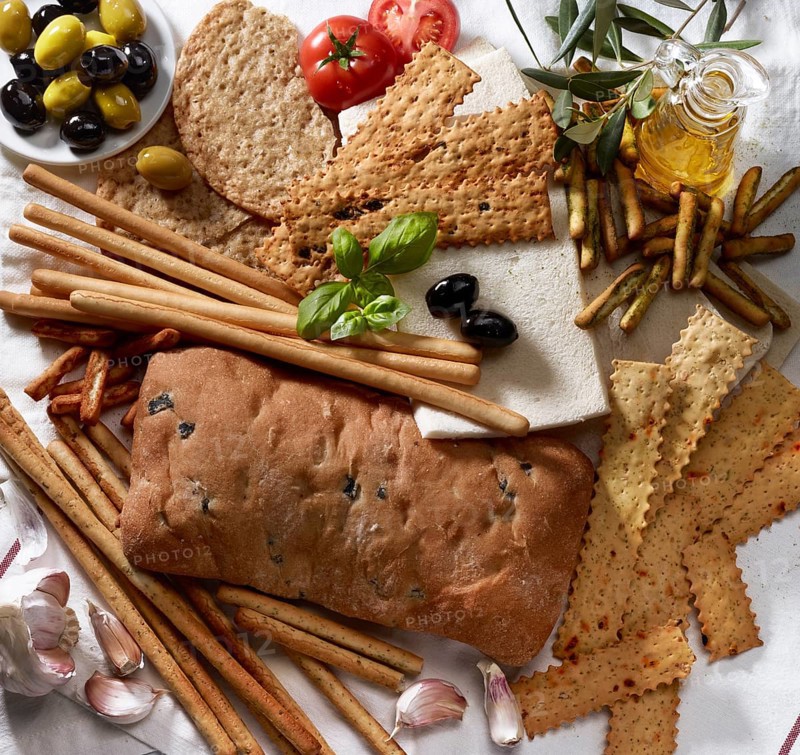 Various Italian baked goods with decoration of olive branches