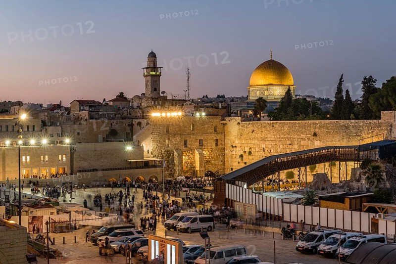 Believers at the Wailing Wall at dusk