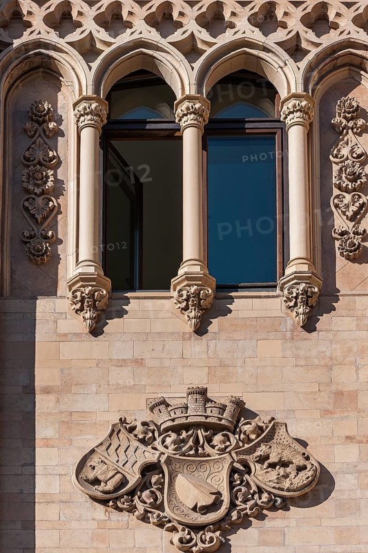 Arched windows and coats of arms