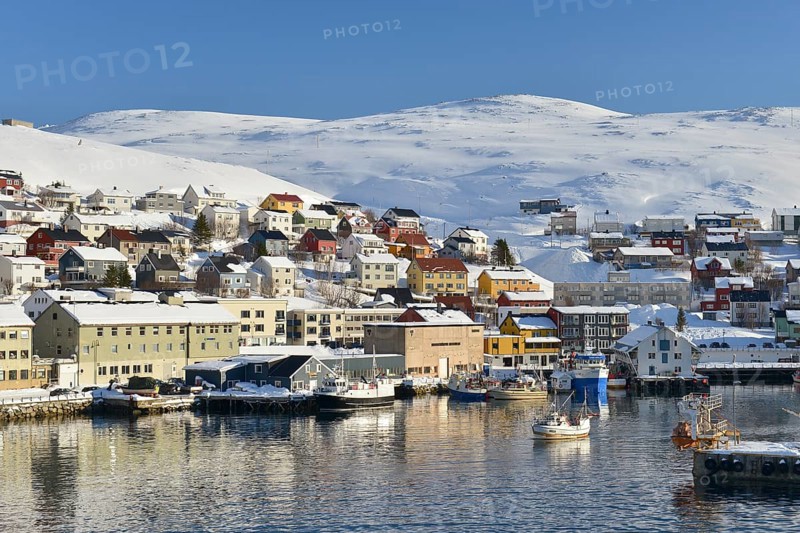 Harbor with snow covered mountains