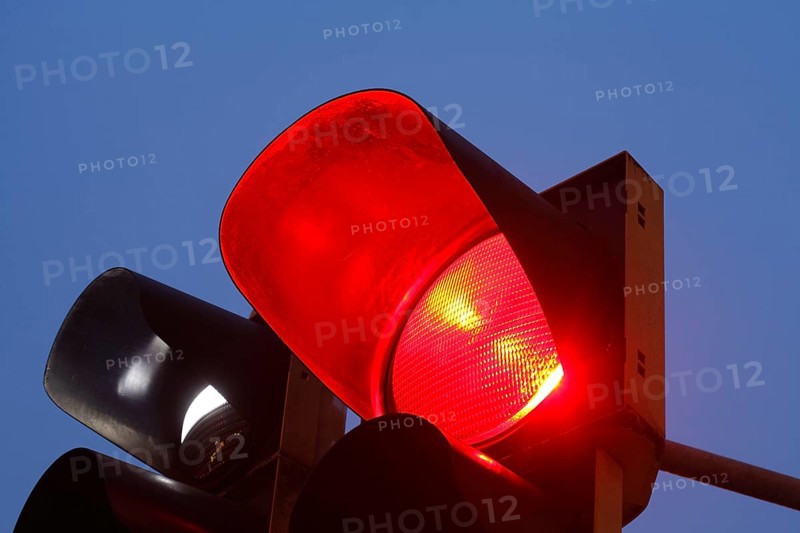 Red traffic lights at dusk