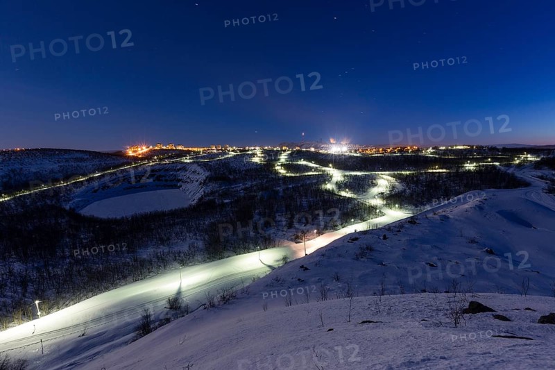 Lit cross-country ski trail at night