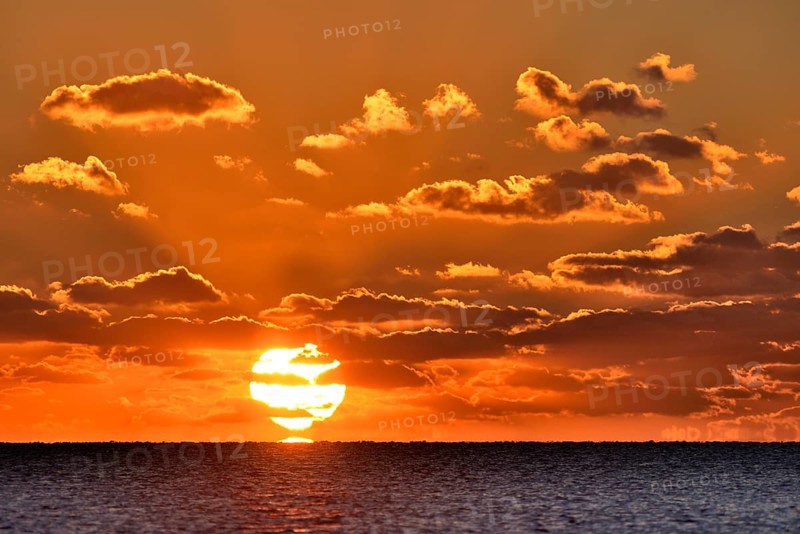 Sunset with cloudy sky above the North Sea