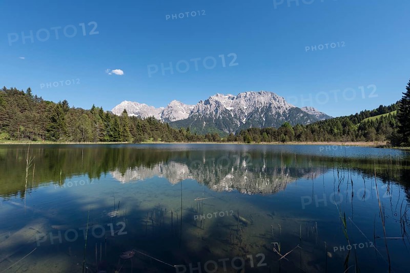 Western Karwendelspitze is reflected in the Luttensee
