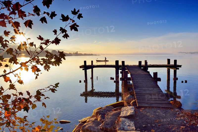 Wooden footbridge at the Lake Pfaffikersee at sunrise