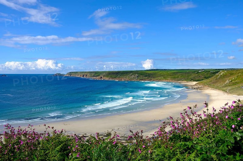 Wide sandy beach with waves