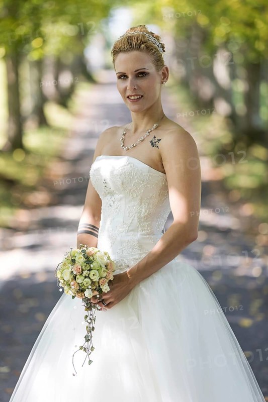 Young blonde woman in a white wedding dress