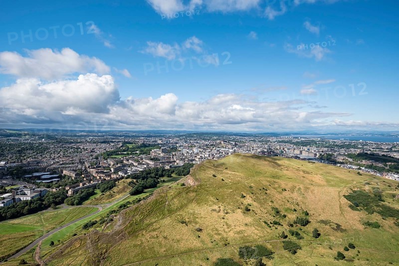 View across cliffs of Salisbury Crags into city of Edinburgh from Arthur's Seat
