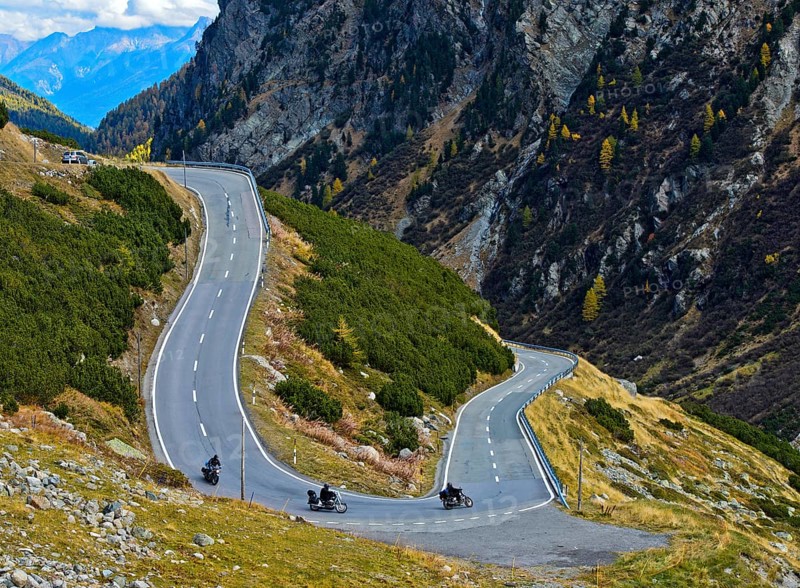 Motorcycles in a hairpin curve on mountain road