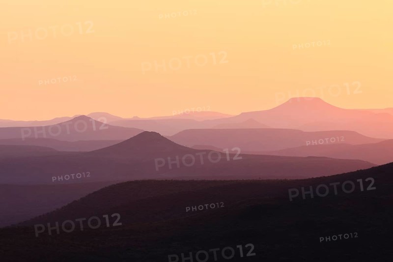 Staggered mountains at sunset