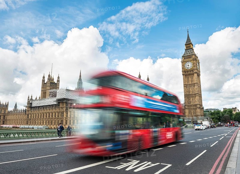 Red double-decker bus on the Westminster Bridge