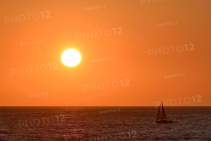 Sailboat at sunset over the North Sea