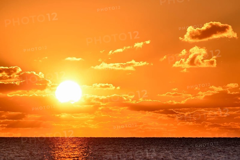 Sunset with cloudy sky above the North Sea