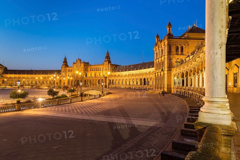 Illuminated Plaza de Espana at dusk