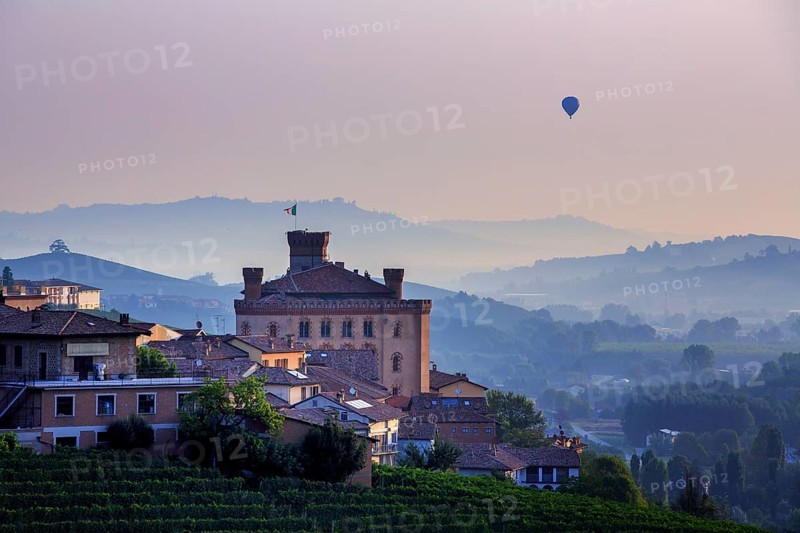 Hot-air balloon at sunrise over Barolo