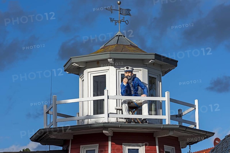 Figure of a captain on a tower