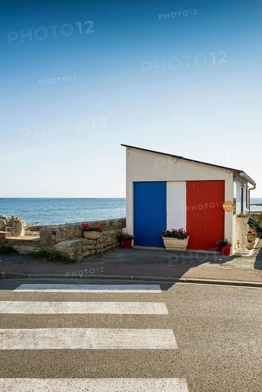 Garage by the sea painted in French national colours