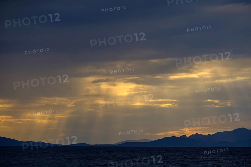 Thunderclouds at sunset on the beach