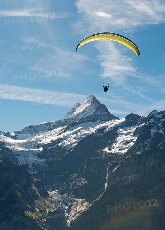 Paraglider flying in the sky
