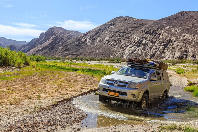 Off-road vehicle crosses Hoarusib River