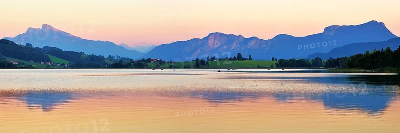 Lake Irrsee at dusk with Salzkammergut and the Dachstein Mountains