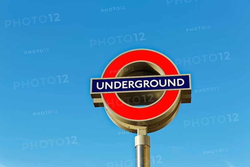 Underground signboard against blue sky
