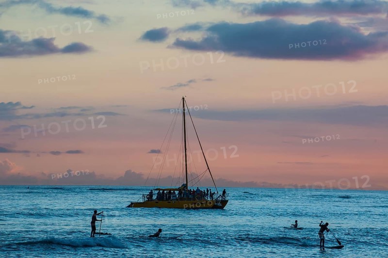 Evening light over sailing boat at Waikiki Beach