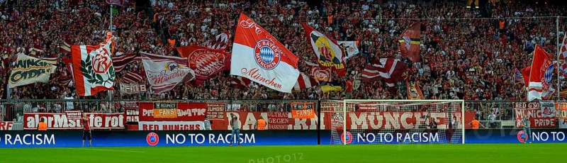 FC Bayern football fans holding flags