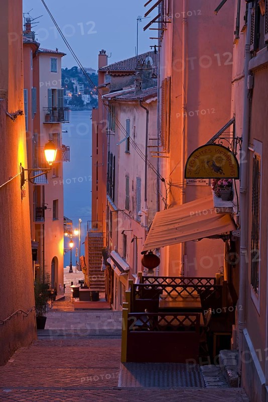 Steep narrow alley illuminated