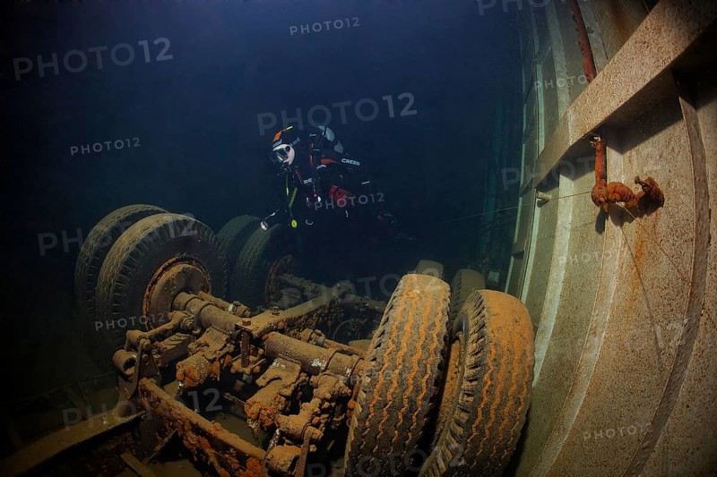 Diver looking at lorry in hold