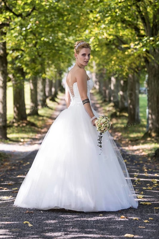 Young blonde woman in a white wedding dress