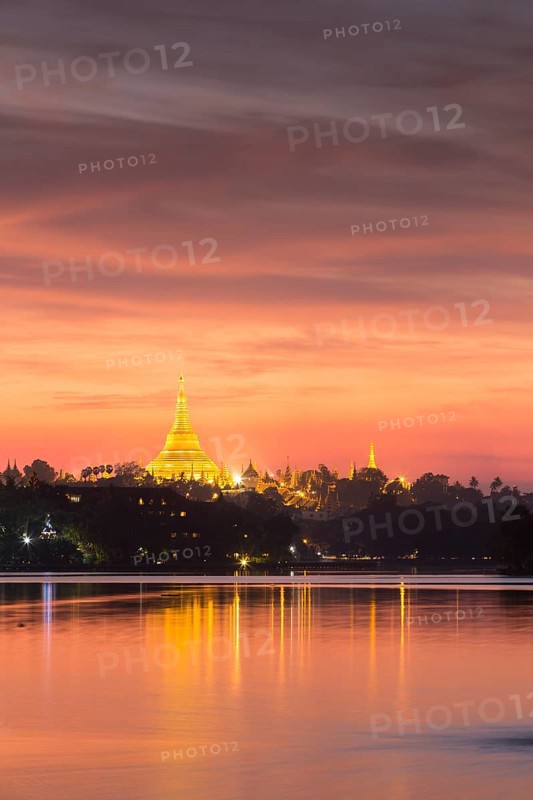 Illuminated Shwedagon Pagoda at sunset