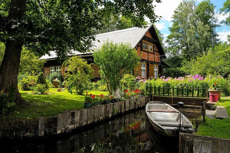 Spreewald house with boat on Fliess river