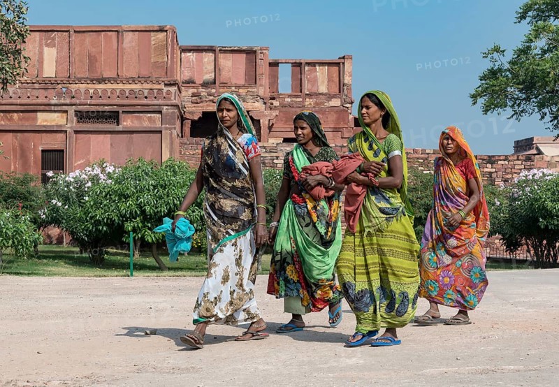 Indian women in traditional colorful sari dresses