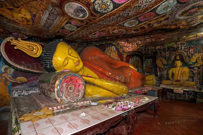 Reclining Buddha statue and painted ceilings