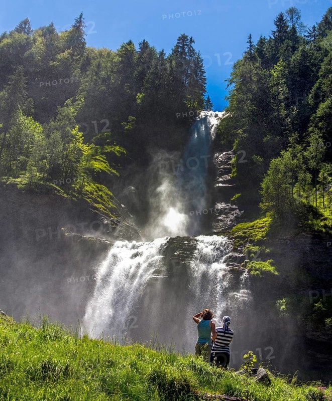 Two women in front of Rouget waterfall
