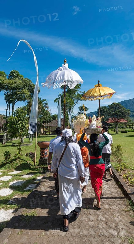 Procession of devout Buddhists with offerings