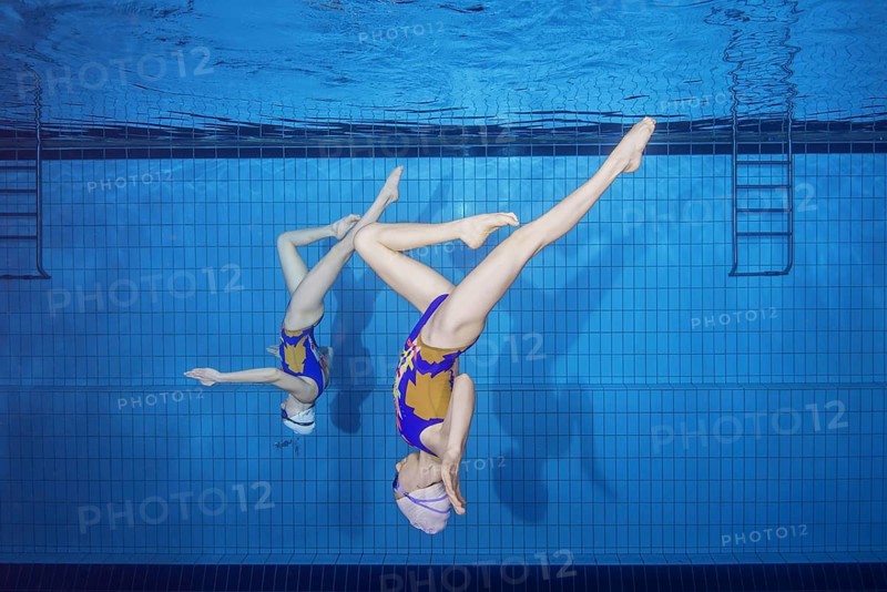 Underwater view of Synchronized Swimming in a swimming pool
