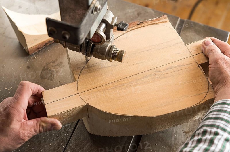 Cutting a wooden block using a band saw