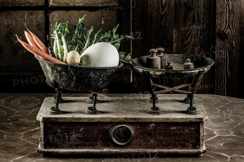 Old scales with egg
