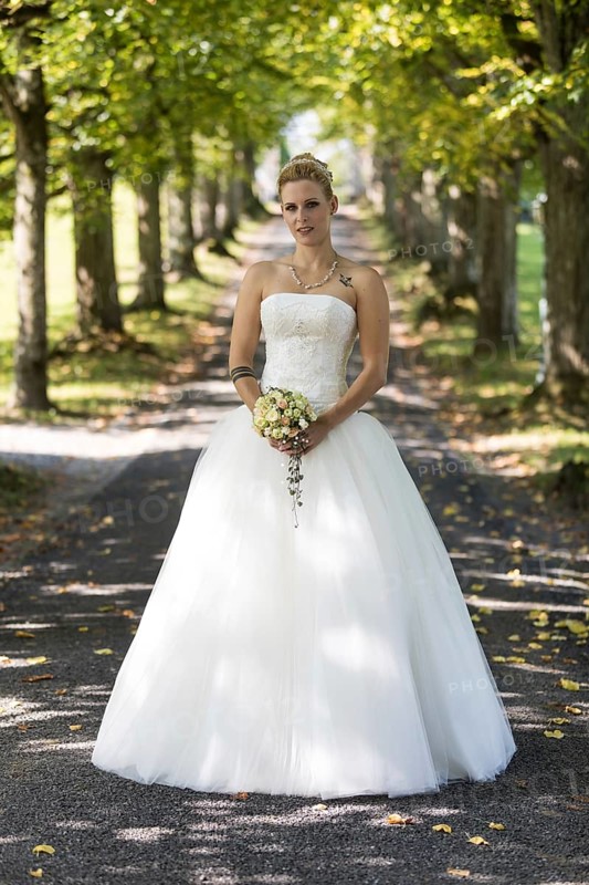 Young blonde woman in a white wedding dress