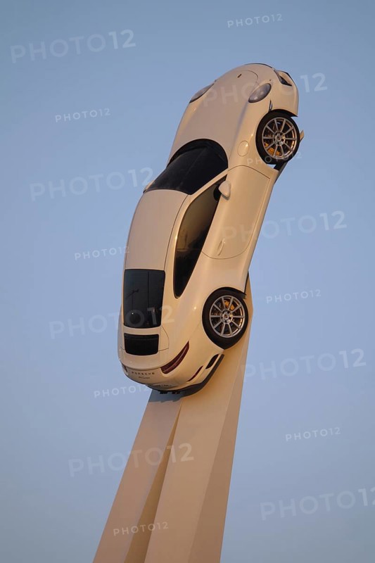 Porsche 911 Carrera 2015 on white stele