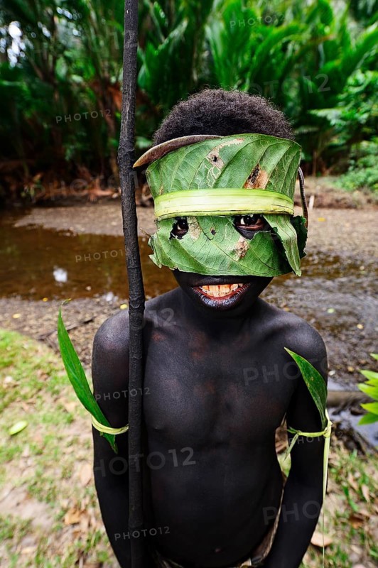 Korafe-child with facial and headdress made of leaves