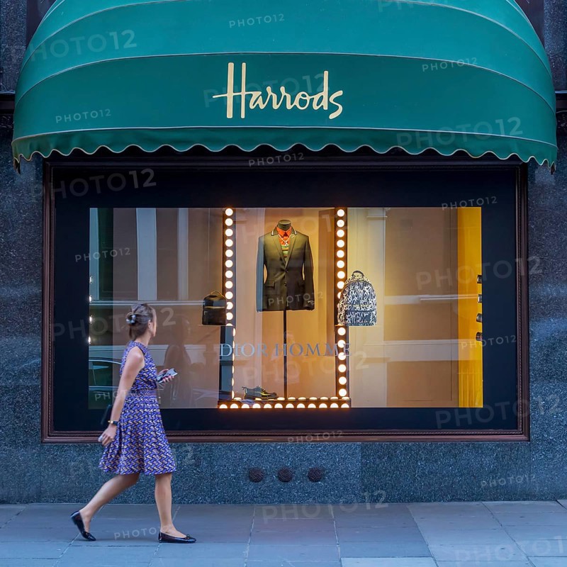 Passer-by in front of a shop window