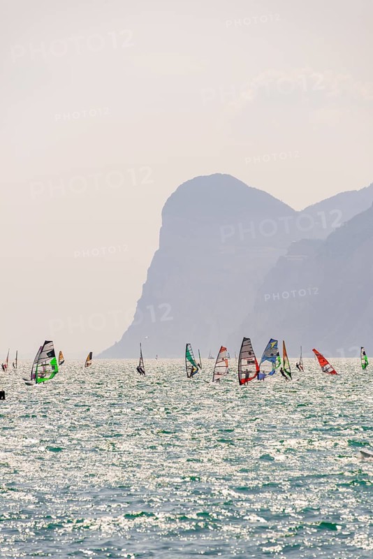 Many windsurfers with colourful sails