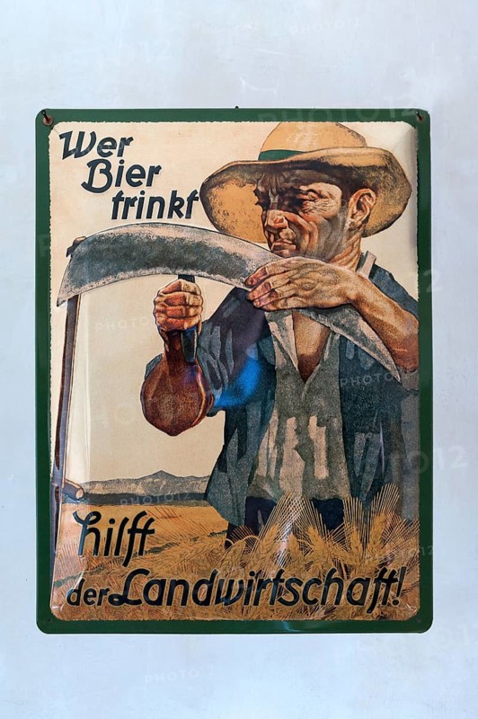 Vintage advertising sign made of sheet metal