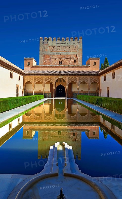 Arabesque Moorish architecture and pond of the Court of the Myrtles of the Palacios Nazaries