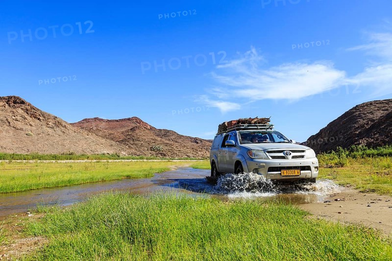 Off-road vehicle crosses Hoarusib River